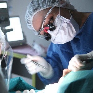 Dentist performing surgery