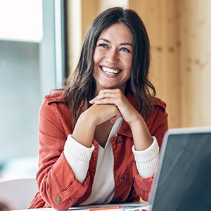 Woman smiling during work meeting at office