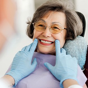 Dentist examining patient's smile